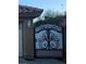 An ornate, wrought-iron gate is a unique feature at 1163 Spanish Armada Rd, Las Vegas, NV 89123