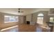 Spacious living room featuring hardwood floors, a fireplace and several windows bringing in natural light at 1163 Spanish Armada Rd, Las Vegas, NV 89123