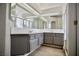 Bathroom featuring a double vanity with ample counter space and modern fixtures at 1171 Middleriver Ct, Las Vegas, NV 89123