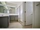 Bathroom featuring a double vanity with a shower and neutral color scheme at 1171 Middleriver Ct, Las Vegas, NV 89123