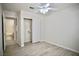 Bright, modern bedroom with wood-look floors and ensuite bath at 1171 Middleriver Ct, Las Vegas, NV 89123