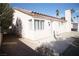 Exterior of home featuring desert landscaping, shutters and covered patio at 1171 Middleriver Ct, Las Vegas, NV 89123