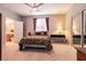 Spacious bedroom with a queen bed, mirrored closet doors, and a window with decorative curtains at 1313 Gallery Oaks Dr, Las Vegas, NV 89123