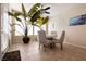 Bright dining area with a ceiling fan and lots of natural light from large windows at 1313 Gallery Oaks Dr, Las Vegas, NV 89123