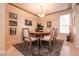 Cozy dining room featuring a decorative light fixture and a large window at 1313 Gallery Oaks Dr, Las Vegas, NV 89123