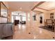Spacious living area with multiple connected living spaces and tiled floors at 1313 Gallery Oaks Dr, Las Vegas, NV 89123