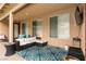 Covered patio with comfortable seating and an outdoor entertainment area at 1313 Gallery Oaks Dr, Las Vegas, NV 89123
