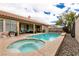 Backyard view showcasing a private pool, spa, and patio area ideal for outdoor enjoyment at 1313 Gallery Oaks Dr, Las Vegas, NV 89123
