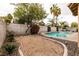 Backyard with a private pool, raised waterfalls, a jacuzzi, and an outdoor seating area at 1313 Gallery Oaks Dr, Las Vegas, NV 89123