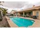 Private backyard swimming pool and patio with multiple seating areas and a nearby spa at 1313 Gallery Oaks Dr, Las Vegas, NV 89123