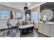 Luxurious bathroom featuring modern tub, stylish vanities, and decorative light fixtures at 1486 Neyland Dr, Henderson, NV 89012