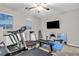 Well-equipped exercise room with a treadmill, free weights, and mirrored walls at 1486 Neyland Dr, Henderson, NV 89012
