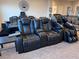 Upstairs living area with reclining chairs and a ceiling fan at 1486 Neyland Dr, Henderson, NV 89012