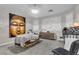 Relax in this peaceful living space with natural light and a calming Buddha wall art at 1486 Neyland Dr, Henderson, NV 89012