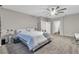 Spacious main bedroom with neutral tones, a ceiling fan, and lots of natural light at 1486 Neyland Dr, Henderson, NV 89012