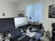 Functional home office with dual monitors, ample desk space, and natural light at 1486 Neyland Dr, Henderson, NV 89012