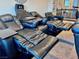 Relax in the theatre room with reclining leather chairs and built-in features at 1486 Neyland Dr, Henderson, NV 89012