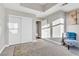 Neutral bedroom features a large closet, a cozy chair, and an ensuite bathroom at 150 Las Vegas Blvd # 1711, Las Vegas, NV 89101