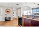 Modern kitchen with stainless steel sink, wine fridge, and granite countertops at 150 Las Vegas Blvd # 1711, Las Vegas, NV 89101