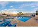 Rooftop pool and hot tub area offering city views, lounge seating, and blue skies at 150 Las Vegas Blvd # 1711, Las Vegas, NV 89101