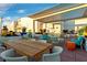 Enjoy rooftop relaxation in this covered lounge with vibrant planters and outdoor seating under a bright sky at 150 Las Vegas Blvd # 1711, Las Vegas, NV 89101