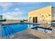 Refreshing rooftop pool and hot tub with lounge chairs, clear city views, and a sleek, modern design at 150 Las Vegas Blvd # 1711, Las Vegas, NV 89101