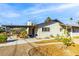 Charming backyard featuring a covered patio with comfortable outdoor furniture, a well-maintained yard, and desert landscaping at 1513 Kirkland Ave, Las Vegas, NV 89102