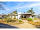 Charming home featuring a large backyard with mature trees and a covered patio seating area at 1513 Kirkland Ave, Las Vegas, NV 89102