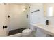 Bathroom features black river rock shower floor, tiled walls and sink with black water fixture at 1513 Kirkland Ave, Las Vegas, NV 89102