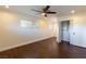 Bedroom features wood floors, ceiling fan, recessed lights, closet with sliding doors and a window at 1513 Kirkland Ave, Las Vegas, NV 89102