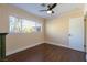 Bedroom features wood floors, ceiling fan, window providing natural light at 1513 Kirkland Ave, Las Vegas, NV 89102