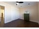 Bedroom features wood floors, closet with bi-fold doors, and green dresser for storage at 1513 Kirkland Ave, Las Vegas, NV 89102