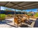 Cozy covered patio with comfortable seating arrangements in a well-maintained backyard, perfect for relaxation and gatherings at 1513 Kirkland Ave, Las Vegas, NV 89102