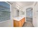 Well-lit bathroom with a double sink vanity and large window at 1552 Wild Willey Way, Henderson, NV 89002