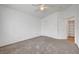 Spacious bedroom features neutral carpet and a ceiling fan, plus closet and ensuite bath at 1552 Wild Willey Way, Henderson, NV 89002
