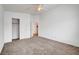 Spacious bedroom features neutral carpet and a ceiling fan, plus closet and ensuite bath at 1552 Wild Willey Way, Henderson, NV 89002