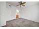 Spacious bedroom with a ceiling fan and doorway to the bathroom at 1552 Wild Willey Way, Henderson, NV 89002