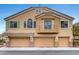 Charming home featuring a three-car garage and neutral stucco exterior with lovely architectural details at 1552 Wild Willey Way, Henderson, NV 89002