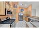 Kitchen with stainless steel appliances and granite countertops at 1552 Wild Willey Way, Henderson, NV 89002