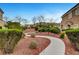 Serene landscaping with winding pathway that shows lush greenery, offering a peaceful and inviting outdoor environment for residents at 1552 Wild Willey Way, Henderson, NV 89002