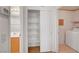Laundry room with shelving is located near the bathroom for added convenience at 1552 Wild Willey Way, Henderson, NV 89002