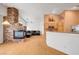 Open concept living area featuring a stone fireplace, and hardwood floors with stylish decor at 1552 Wild Willey Way, Henderson, NV 89002