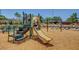 Community playground with a slide, climbing structure, and soft landing surface at 1552 Wild Willey Way, Henderson, NV 89002