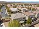 An aerial view of a residential neighborhood featuring well maintained homes at 168 Springhouse St, Las Vegas, NV 89148