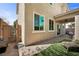 Comfortable lounge seating highlights this backyard's design with landscaped yard at 168 Springhouse St, Las Vegas, NV 89148