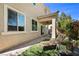 Comfortable lounge seating highlights this backyard's design with landscaped yard at 168 Springhouse St, Las Vegas, NV 89148