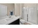 Clean bathroom featuring a vanity, toilet, and glass-enclosed shower at 168 Springhouse St, Las Vegas, NV 89148