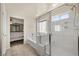 Contemporary bathroom featuring a separate tub and shower, with modern fixtures and elegant tile work at 168 Springhouse St, Las Vegas, NV 89148
