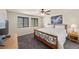 Spacious main bedroom features a comfortable bed, ceiling fan, and windows offering ample natural light at 168 Springhouse St, Las Vegas, NV 89148