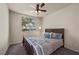 Comfortable bedroom with a large window, neutral carpeting, and soft, inviting bedding at 168 Springhouse St, Las Vegas, NV 89148
